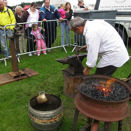 Roy Abbott demonstrating traditional blacksmithing.